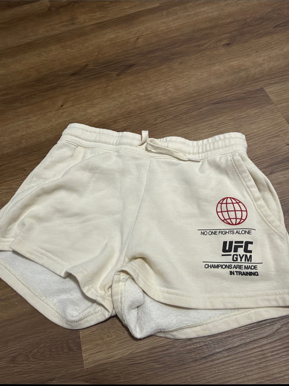 UFC NO ONE FIGHTS ALONE Women's Cream Terry Shorts